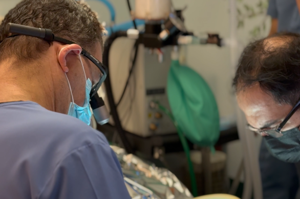 Dr. Sam Morhaim placing dental implants on senior patient at Tribeca Dental Studio NYC