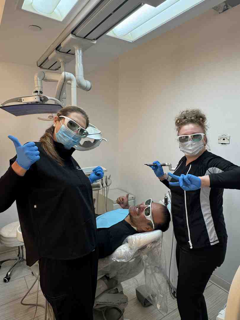 same day dental implants New York patient smiling